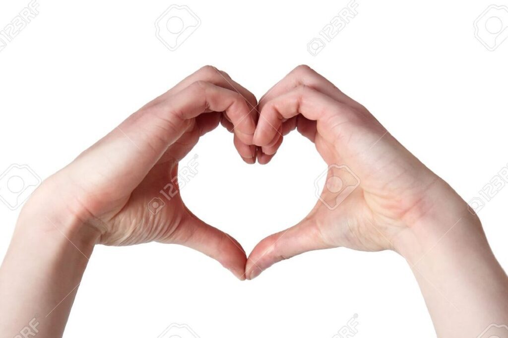 una imagen de dos manos entrelazadas formando un corazon